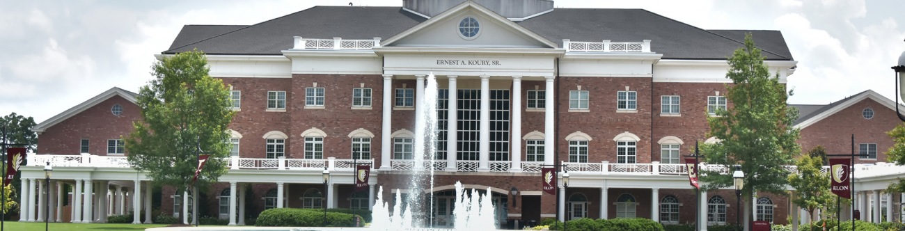 View of building at Elon University with fountain in front of it